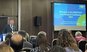 A photograph of Matt Connor, Chief Information Officer at Liverpool Women's NHS Foundation Trust chairing the MEDITECH User Network (MUN) 2022 event in Liverpool