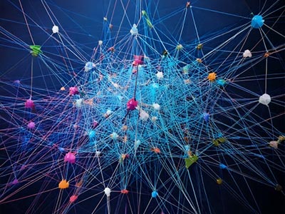 Abstract image of clinician reviewing clinical data across multiple screens