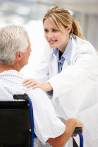 Image of young, female doctor caring for a senior patient